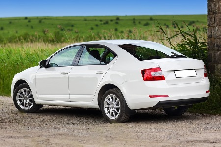 White car on a dirt road
