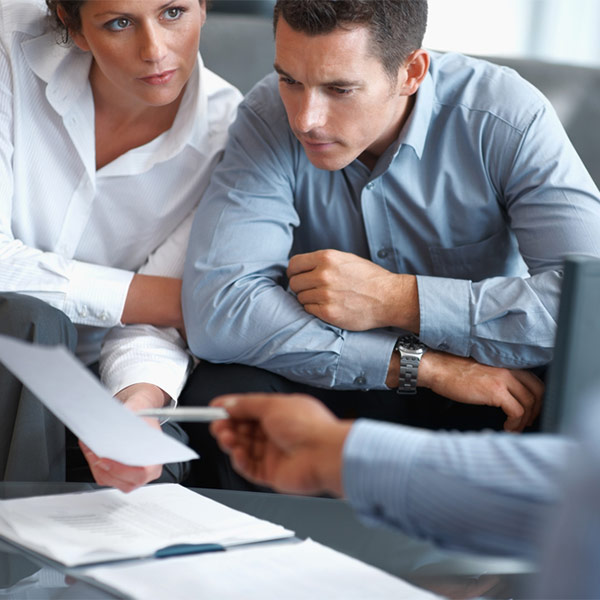 Man and woman looking over papers